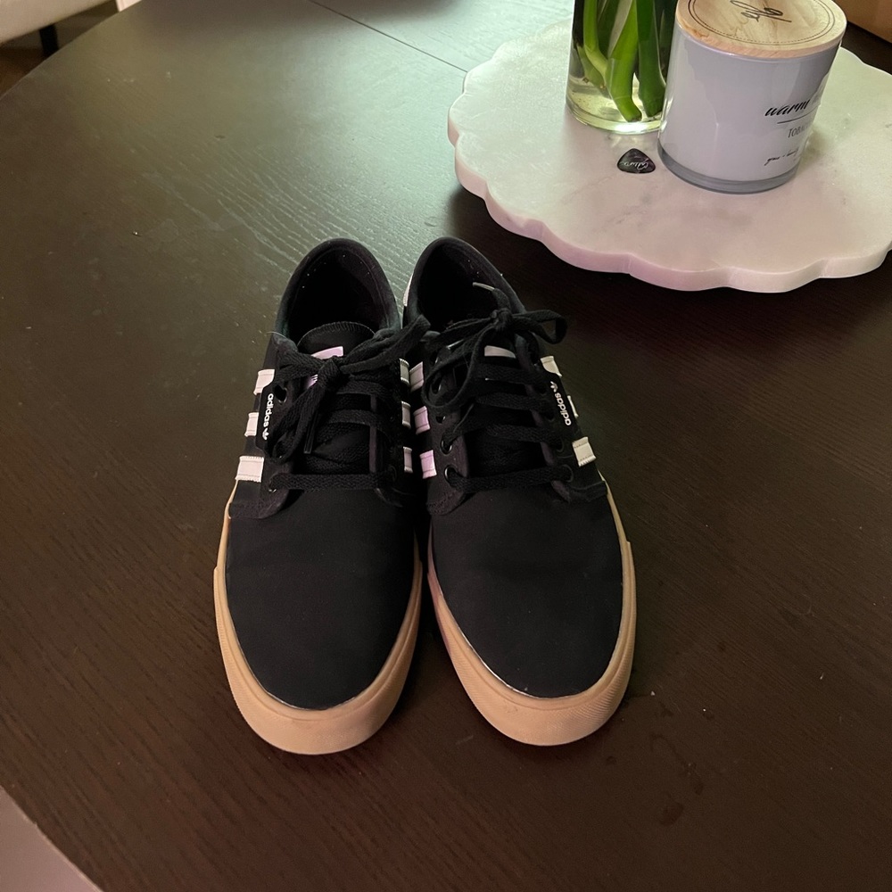 Black adidas gum sole casual sneaker